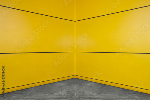 Yellow square layout design wall with cement floor