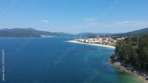 Aerial drone footage views of Portosin. A small coastal village on the northwest of Spain. On a sunny day. photo