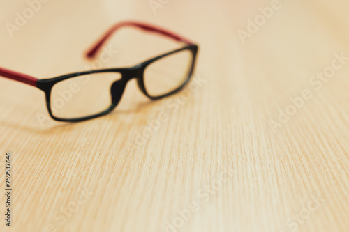 eyeglasses on wooden table office