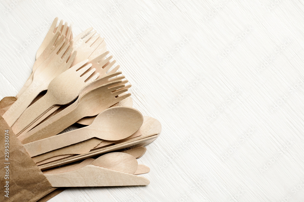 Disposable tableware from natural materials, wooden spoon, fork, knife, eco-friendly. Place for text
