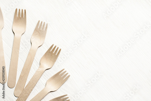 Disposable tableware from natural materials  wooden  fork  knife  eco-friendly. Place for text