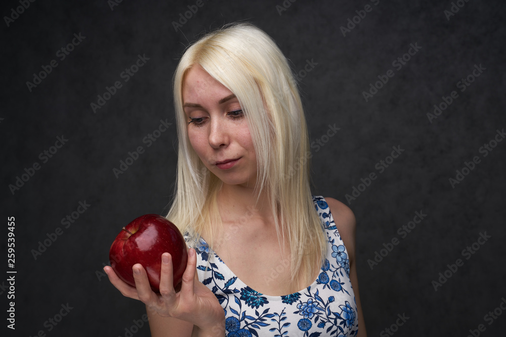 beautiful girl in a fashionable dress with apple beautiful girl in a fashionable dress with apple