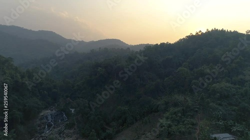 Beautiful Aerial Footage of a Forest with a waterfall in India photo