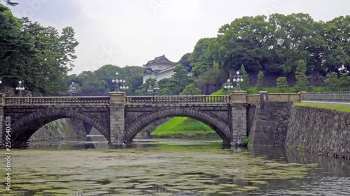 Pan left from walkway to the Seimon Ishibashi  stone bridge leading to the main gate of the  Imperial Palace, Toyko, Japan photo