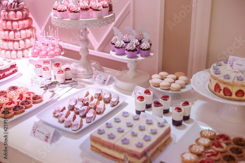 delicious candy bar with cupcakes and other candys