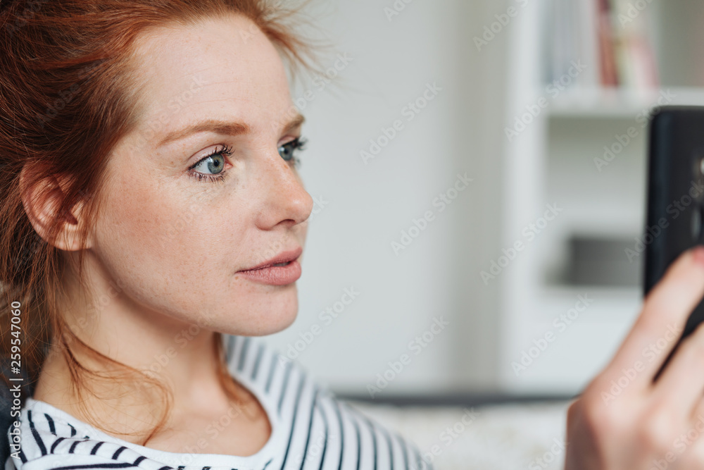 Woman looking at smartphone close-up portrait Woman looking at smartphone close-up portrait