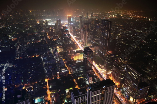 Bangkok  Thailand- December 31  2018   Bangkok night skyscraper from rooftop of The Kingpower Mahanakorn Tower under dust pollution.