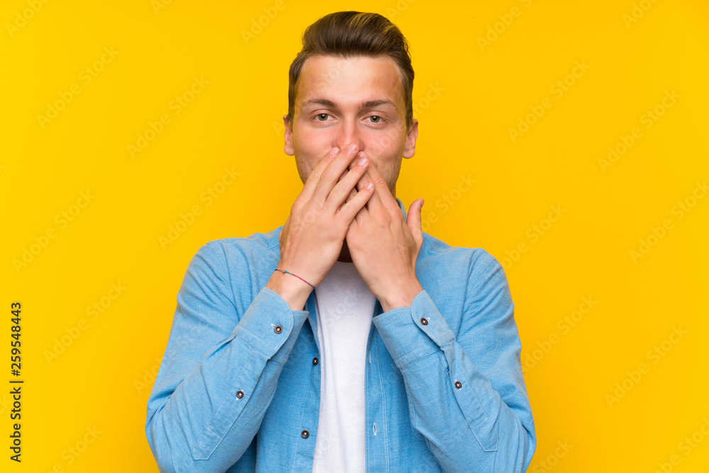 Blonde handsome man over isolated wall with surprise facial expression Blonde handsome man over isolated wall with surprise facial expression