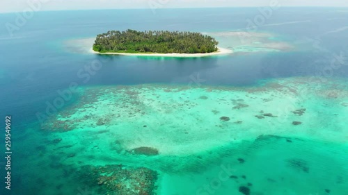 Aerial: flying over tropical island white beach caribbean sea turquoise water coral reef. Indonesia Sumatra Banyak islands. tourist destination diving snorkeling photo