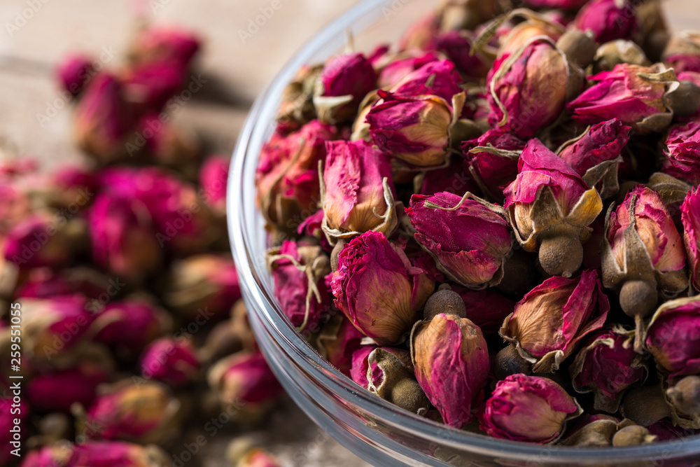 Rose buds in glass bowl. Rose buds in glass bowl.