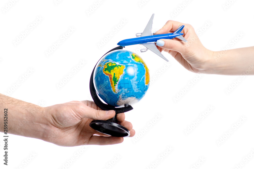Two hands holding globe travel airplane on white ackground isolation Two hands holding globe travel airplane on white ackground isolation