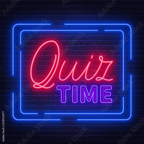 Neon Lettering Quiz time on a brick wall background.