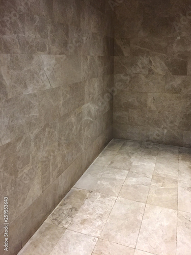 Modern interior design, corner of tile or granite wall and flooring background