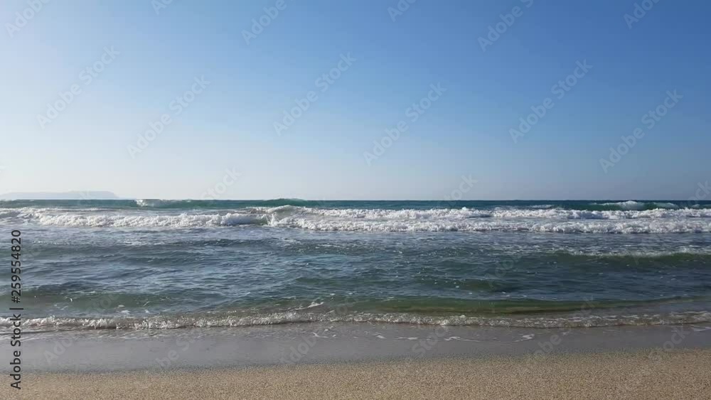Crete Island Greece summer beach with waves on shore panorama Crete Island Greece summer beach with waves on shore panorama
