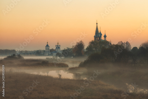 old churches at sunrise in Dunilovo, Russia
