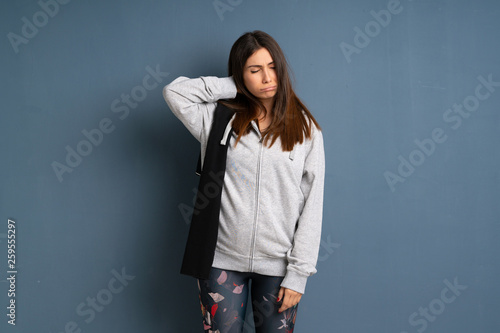 Young sport woman with neckache