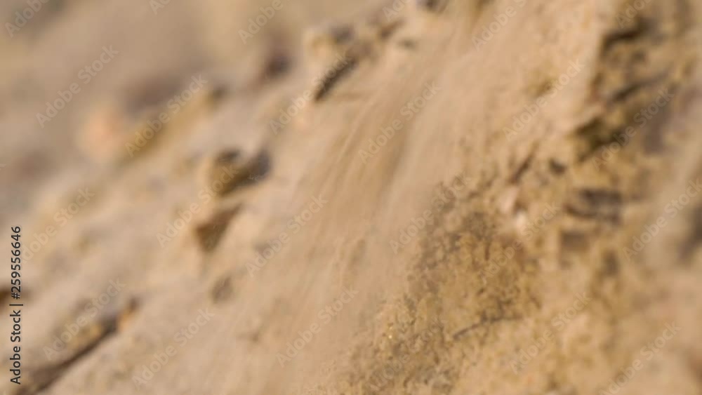 Sand falling down dune slope. Static shot, shallow depth of field Sand falling down dune slope. Static shot, shallow depth of field