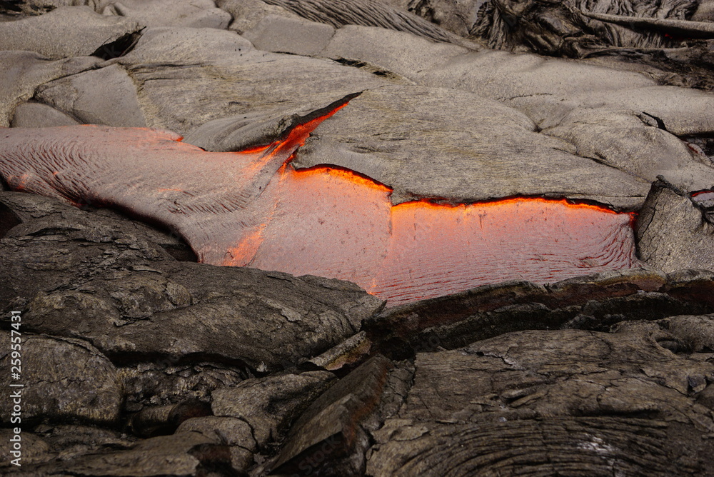Lava field with new hot flowing lava in Big Island in Hawaii Lava field with new hot flowing lava in Big Island in Hawaii