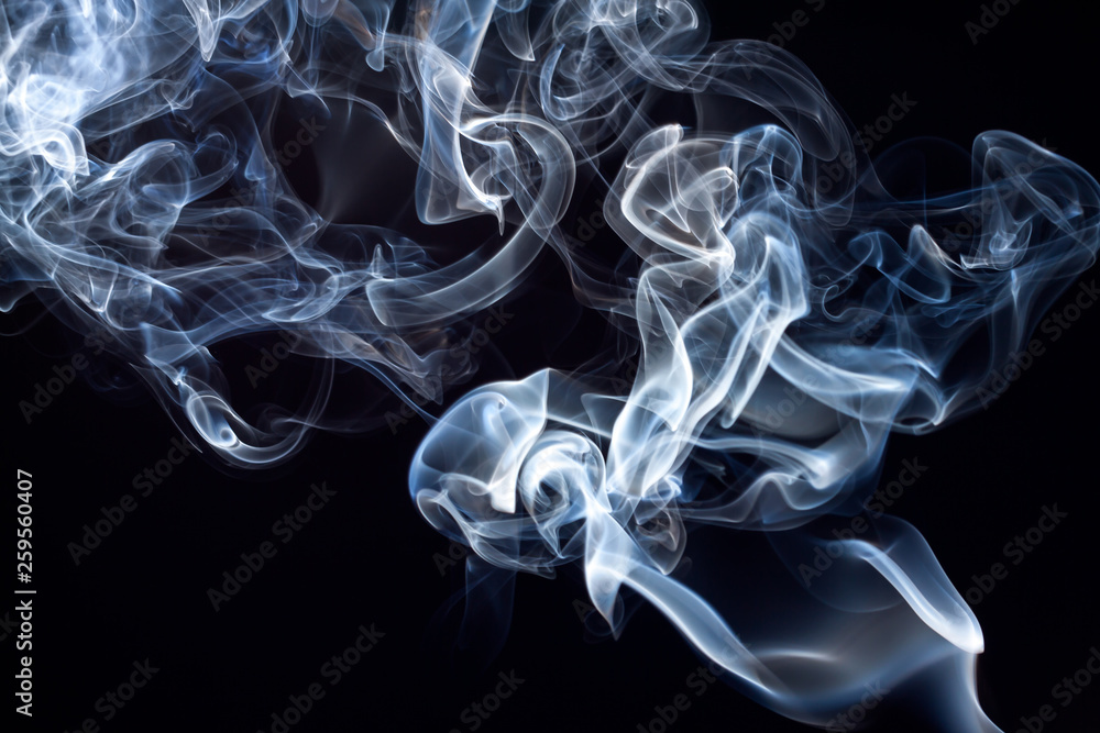Movement of blue and white smoke abstract on black background Movement of blue and white smoke abstract on black background