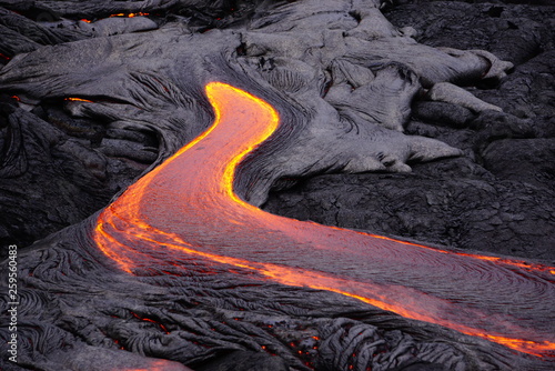 Lava field with new hot flowing lava in Big Island in Hawaii