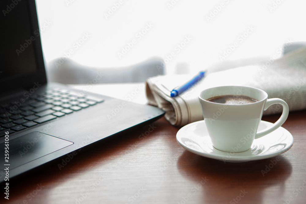 Newspaper with computer on table. Coffee break. Newspaper with computer on table. Coffee break.