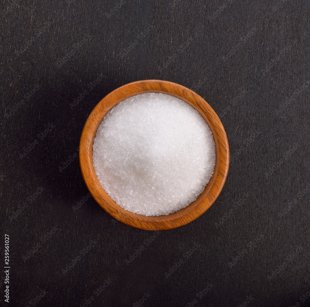 monosodium glutamate on black background monosodium glutamate on black background
