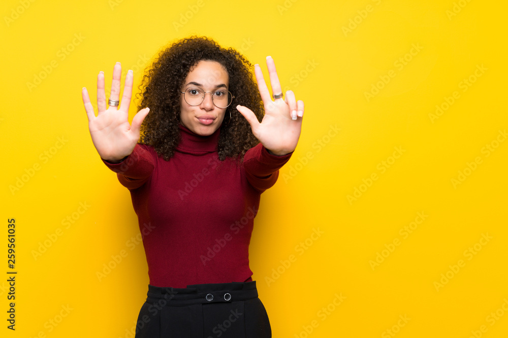 Dominican woman with turtleneck sweater counting eight with fingers Dominican woman with turtleneck sweater counting eight with fingers