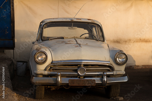 classic retro car with rusty body without car plate © Olga