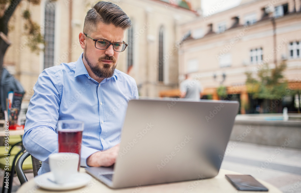 Business man on coffee break in a cafe. Business, education, lifestyle concept Business man on coffee break in a cafe. Business, education, lifestyle concept