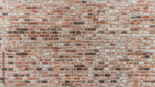 Brick wall of red color, old red brick wall texture background.