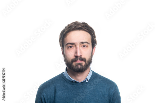 portret of young handsome man with a beard on a white background