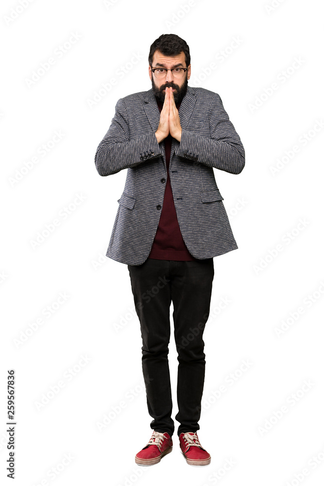 Handsome man with glasses keeps palm together. Person asks for something over isolated white background Handsome man with glasses keeps palm together. Person asks for something over isolated white background
