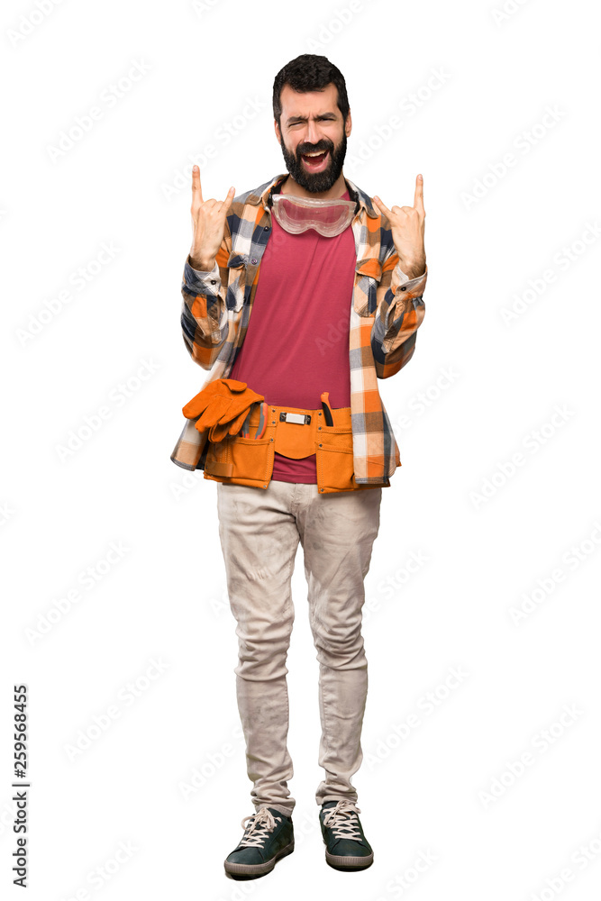 Craftsmen man making rock gesture over isolated white background Craftsmen man making rock gesture over isolated white background