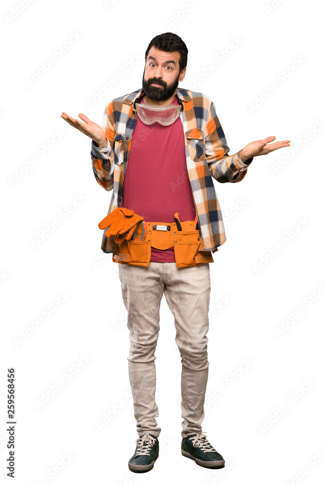 Craftsmen man making doubts gesture over isolated white background Craftsmen man making doubts gesture over isolated white background