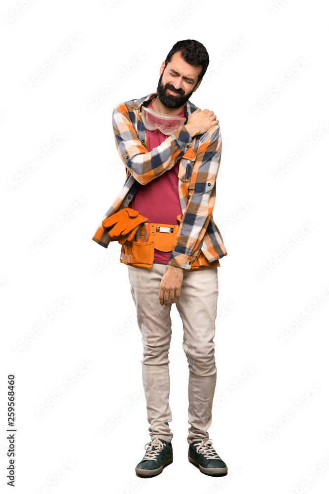 Craftsmen man suffering from pain in shoulder for having made an effort over isolated white background Craftsmen man suffering from pain in shoulder for having made an effort over isolated white background