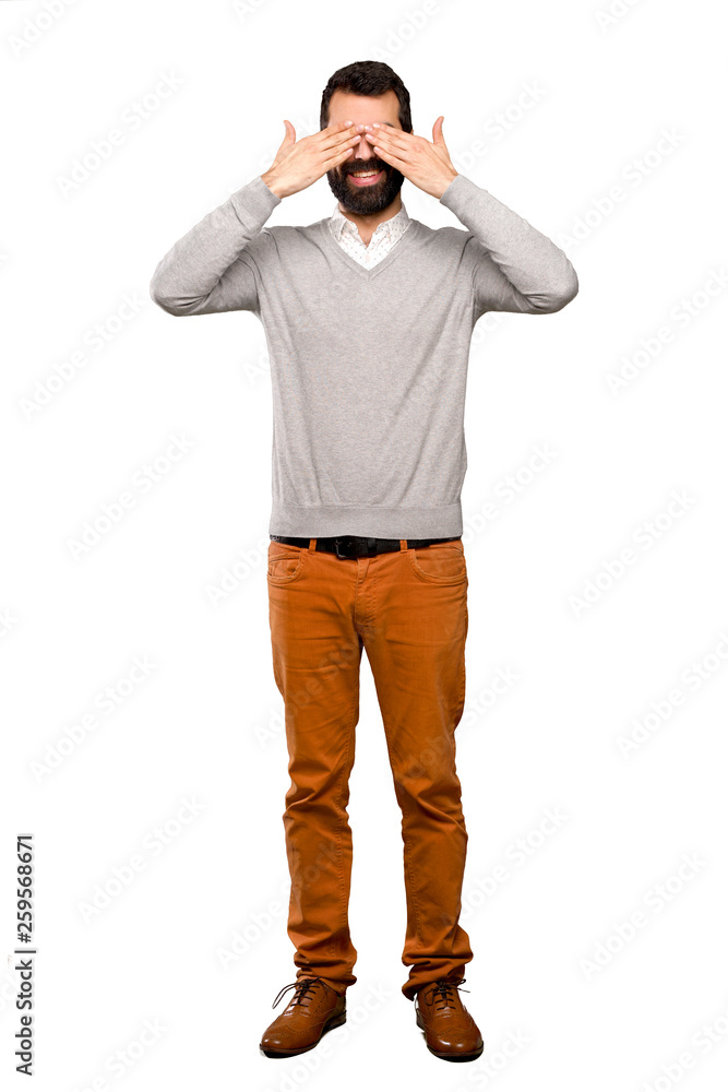 Handsome man covering eyes by hands over isolated white background Handsome man covering eyes by hands over isolated white background