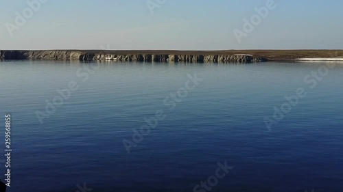 Wallpaper Mural Stone in water and coastline of Arctic Ocean in summer on desert Novaya Zemlya and lonely abandoned world of wildlife and nature of quiet north. Torontodigital.ca