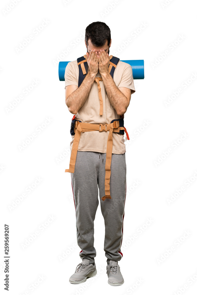 Hiker man with tired and sick expression over isolated white background Hiker man with tired and sick expression over isolated white background