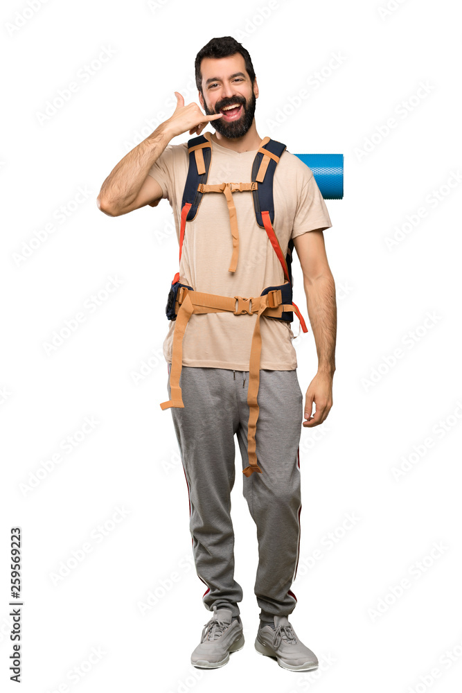 Hiker man making phone gesture. Call me back sign over isolated white background Hiker man making phone gesture. Call me back sign over isolated white background