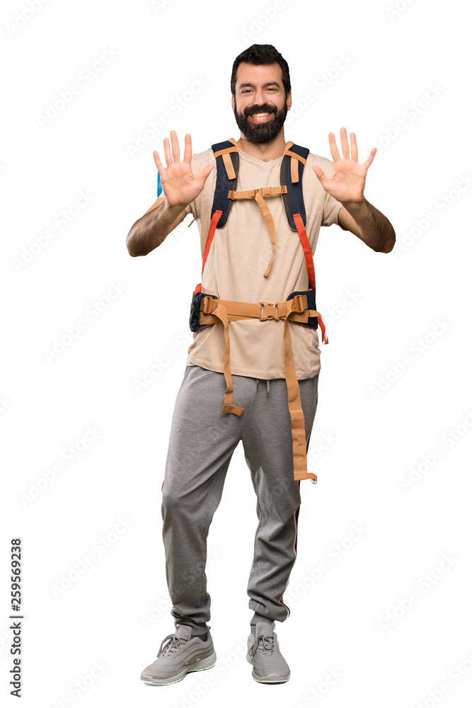 Hiker man counting ten with fingers over isolated white background Hiker man counting ten with fingers over isolated white background