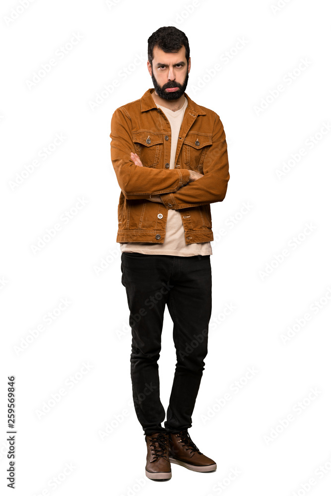 Handsome man with beard with sad and depressed expression over isolated white background Handsome man with beard with sad and depressed expression over isolated white background