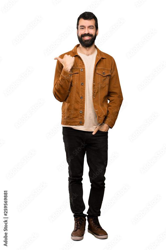 Handsome man with beard pointing to the side to present a product over isolated white background Handsome man with beard pointing to the side to present a product over isolated white background
