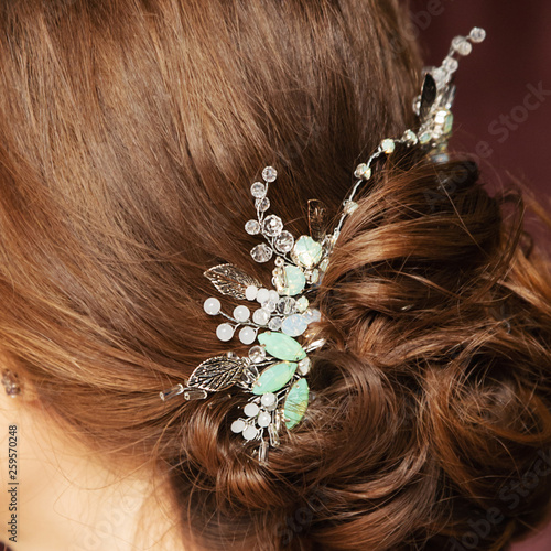 Bride. Bridal wedding hairstyle with jewelry. Elegant hair accessorie.