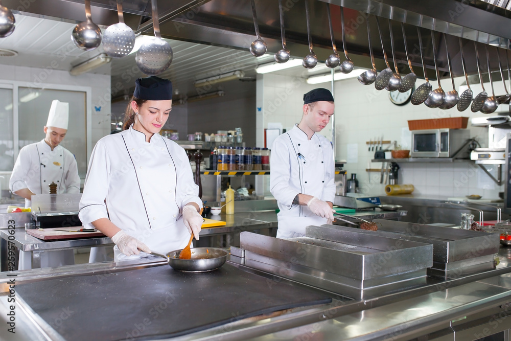 work of a group of chefs in a luxury restaurant. work of a group of chefs in a luxury restaurant.