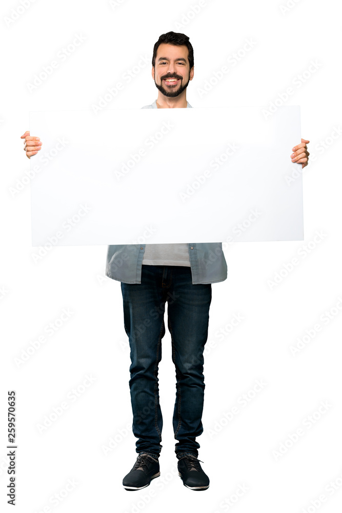 Handsome man with beard holding an empty placard Handsome man with beard holding an empty placard