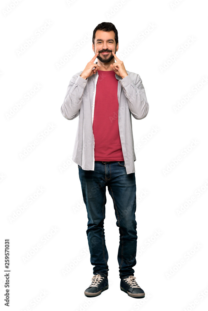 Full-length shot of Handsome man with beard smiling with a happy and pleasant expression over isolated white background Full-length shot of Handsome man with beard smiling with a happy and pleasant expression over isolated white background