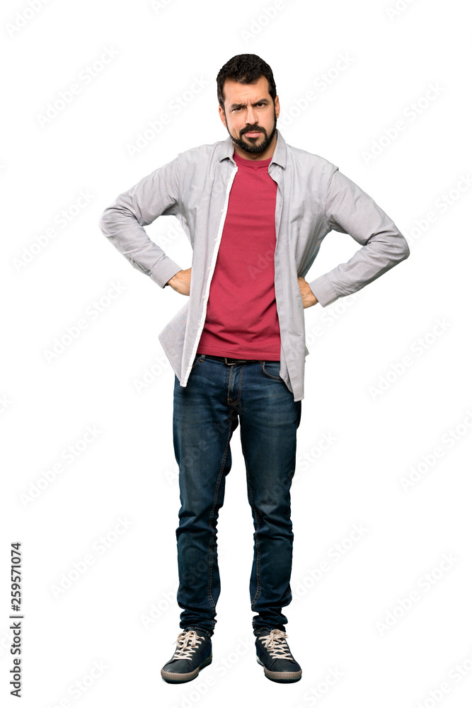 Full-length shot of Handsome man with beard angry over isolated white background Full-length shot of Handsome man with beard angry over isolated white background