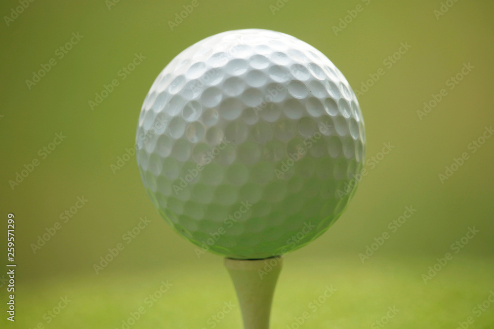 Golf ball on tee in beautiful golf course at sunset background. Golf ball on tee in beautiful golf course at sunset background.