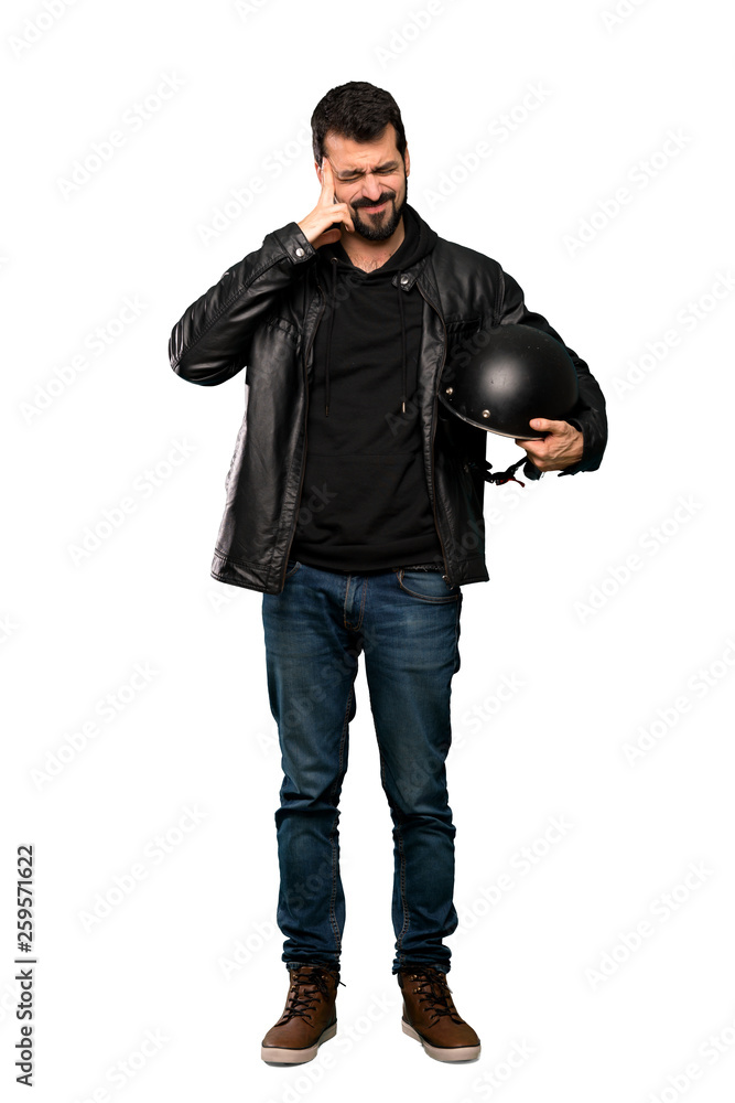 Fototapeta premium Full-length shot of Biker man with headache over isolated white background