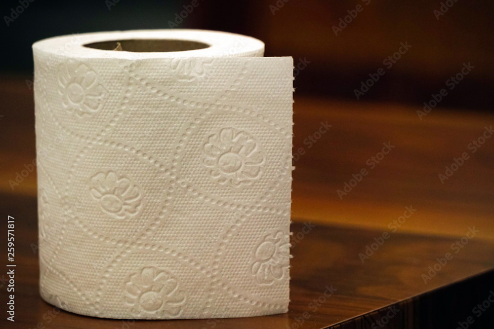 Fototapeta premium Toilet paper on wooden background